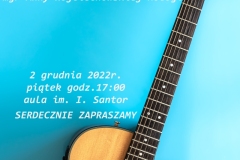 Acoustic guitar on a blue background, top view, copy space.